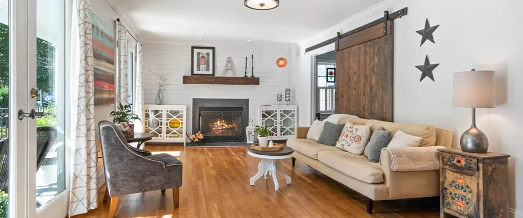 living room with fireplace and wood floors