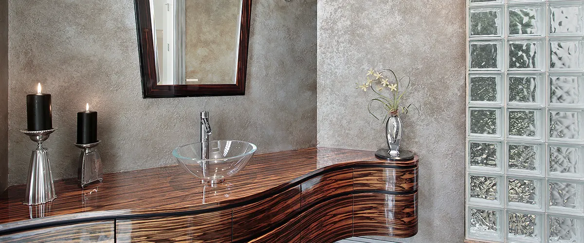 bathroom with wooden cabinet and vintage mirror