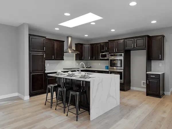 remodeled kitchen with dark cabinets