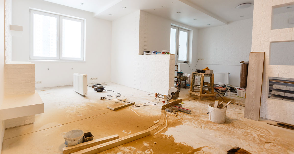 A living space being remodeled into an open-space with a kitchen