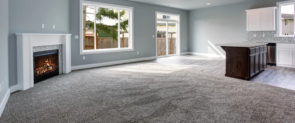new gray carpet flooring in wide living room