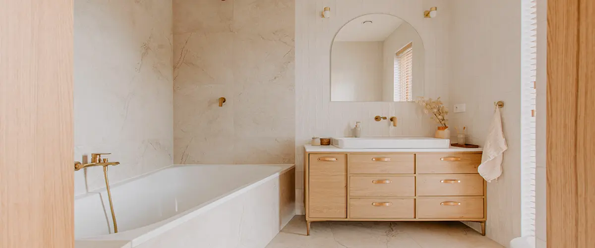 Elegant bathroom with white marble walls and wooden furniture, perfect minimalistic design