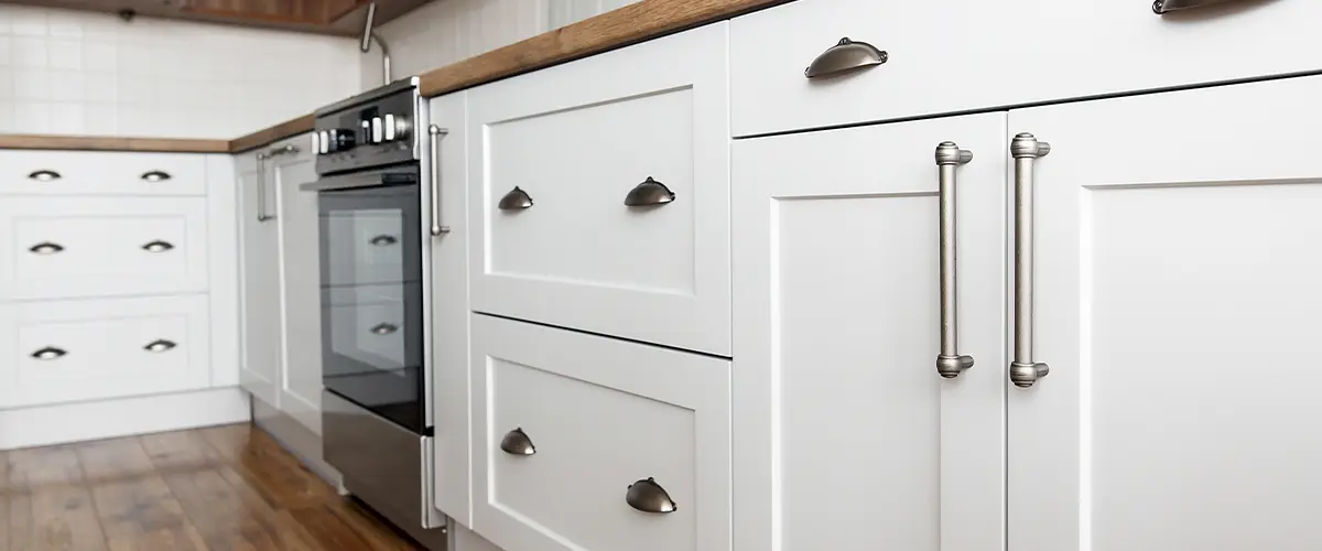 Freshly painted white cabinets in a Pasadena kitchen, showcasing modern cabinet painting.