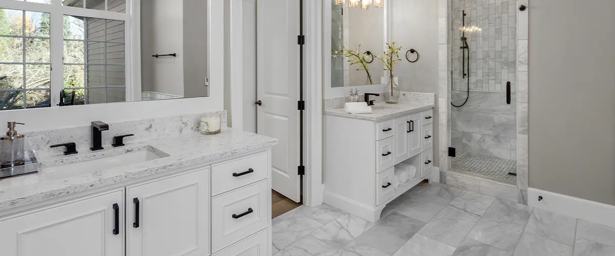 Modern bathroom with double vanity, marble tiles, walk-in shower, and large mirrors - luxury home bathroom design.