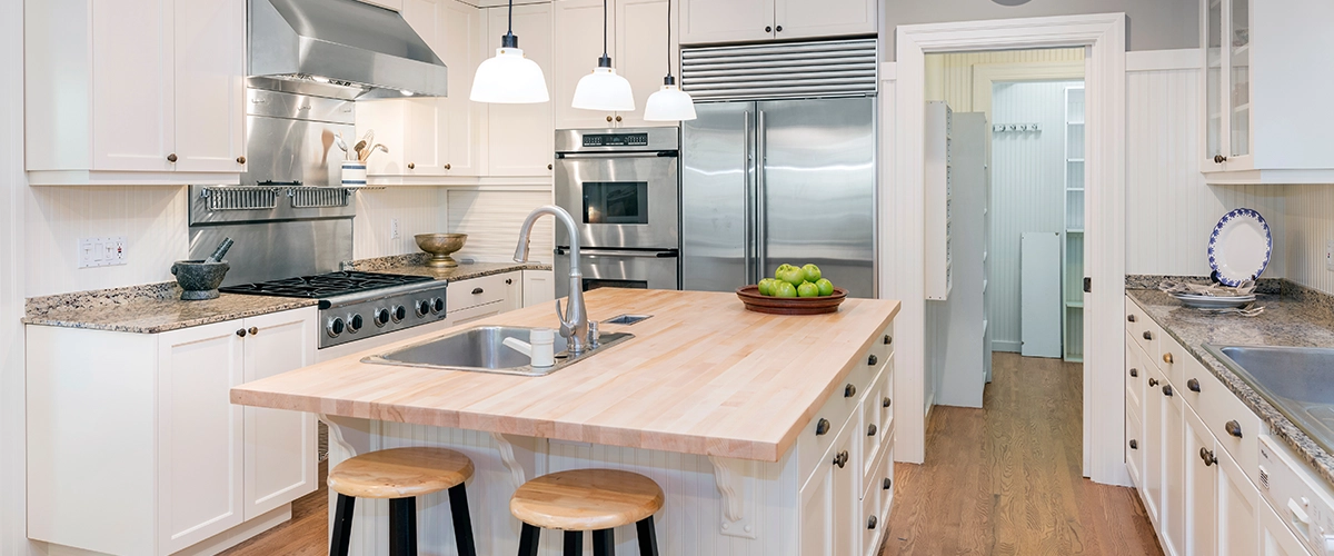 Amazing Luxury Kitchen Interior in white with wooden floor and kitchen island